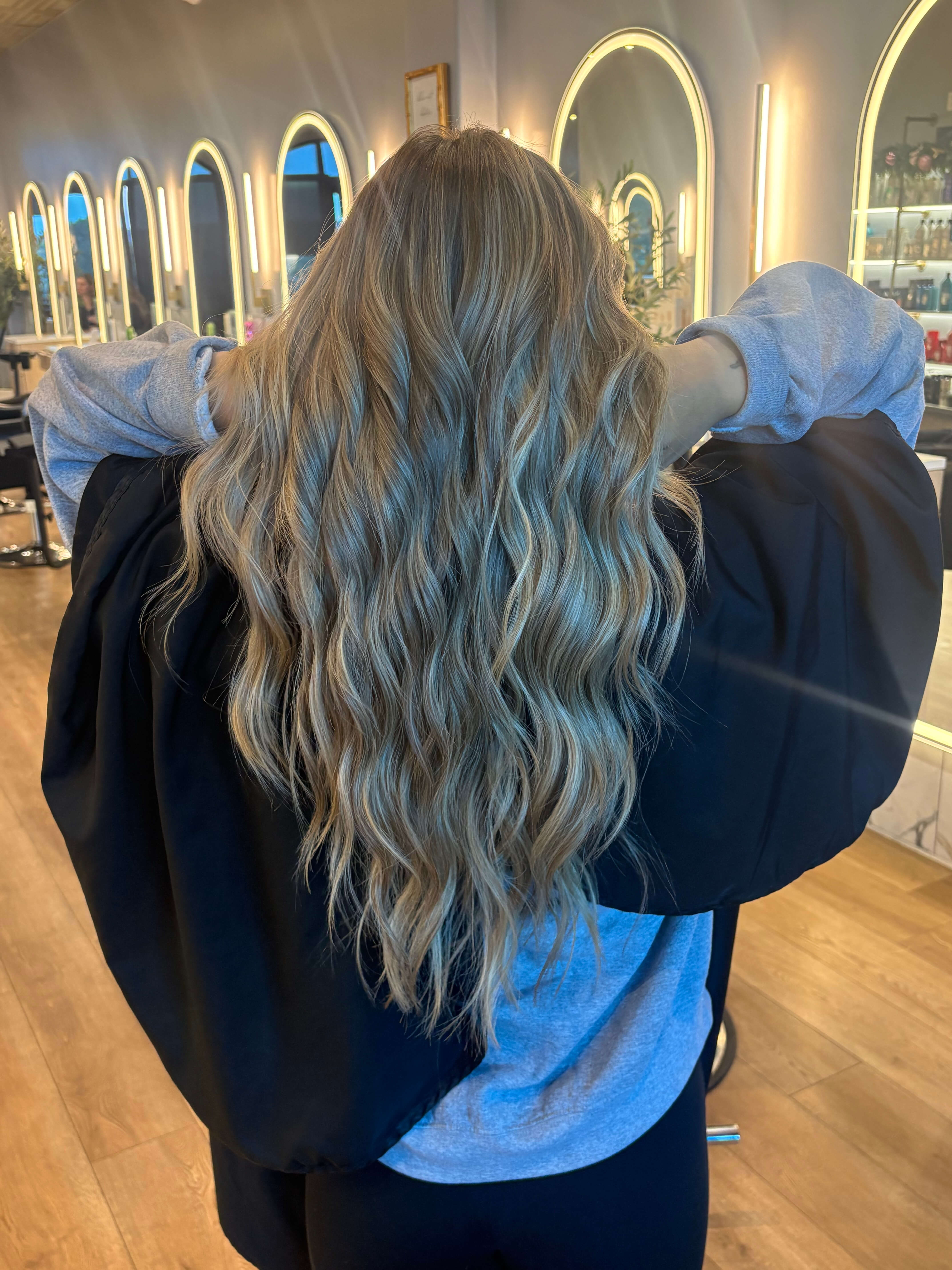 Long, dimensional blonde waves with a reverse balayage, by Karianna